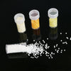 Three clear plastic storage bottles filled with different colored beads for diamond painting and crafts