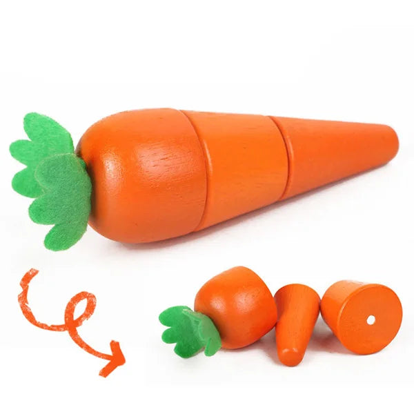 A set of magnetic wooden fruit and vegetable cutting toys, including a carrot and a tomato.