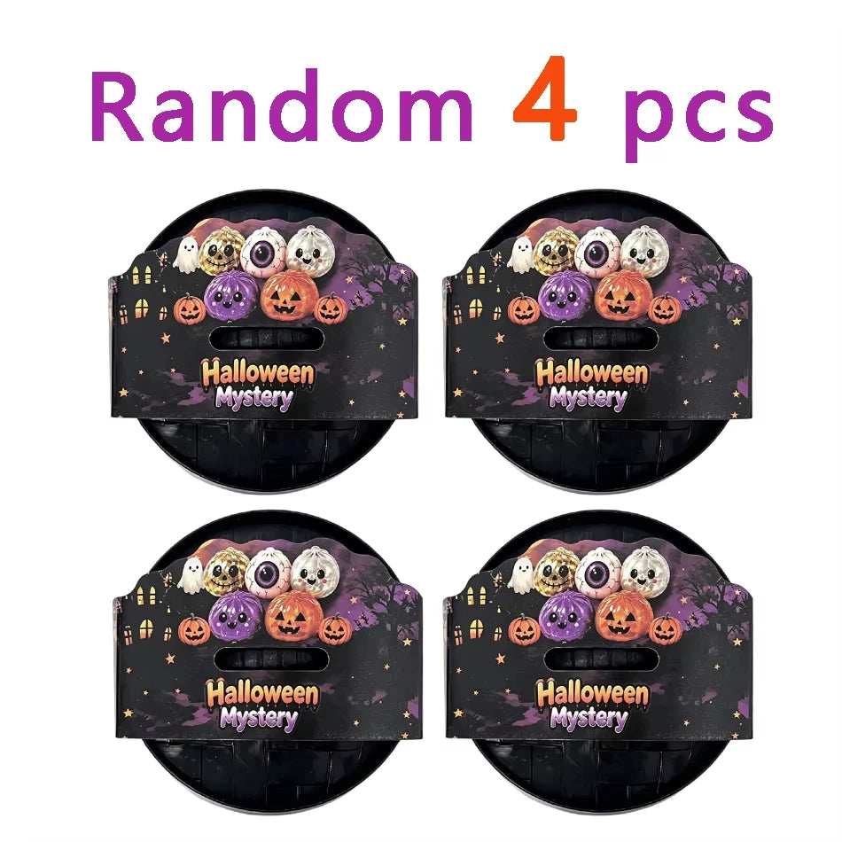 Random set of 4 Halloween mystery squishy fidget toys including glitter pumpkin, eyeball, and skull stress relief balls