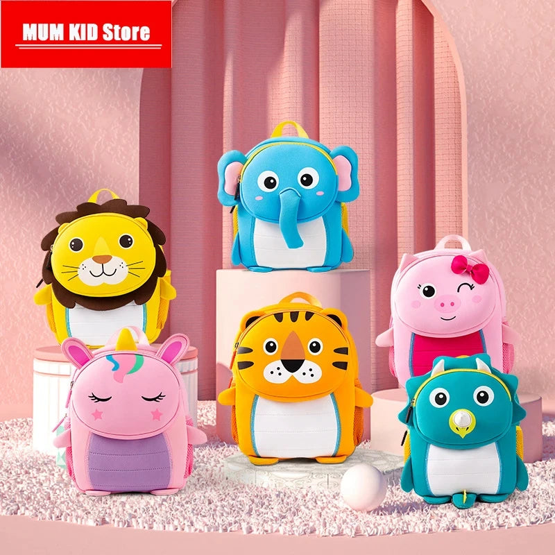 A collection of colorful 3D animal kids backpacks including a lion, elephant, tiger, pink pig, and blue owl.