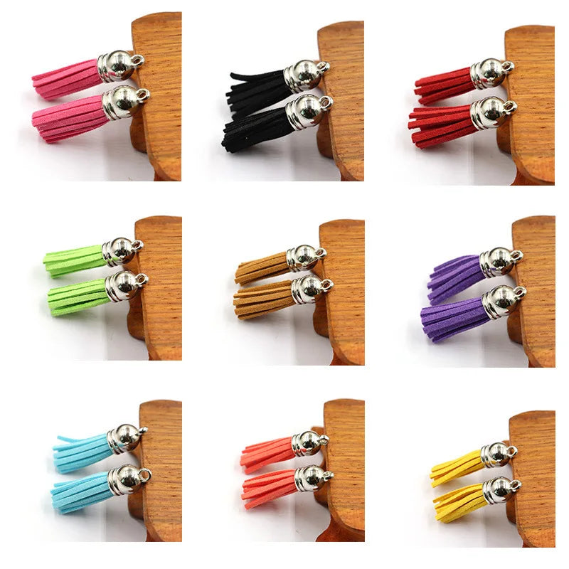 A collection of mixed color velvet tassels in various shades including pink, black, red, and purple, displayed on wooden bloc