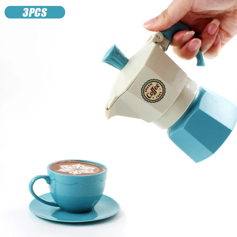 A hand is holding a light blue and beige pretend play coffee maker and cup set for children.