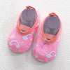 Pink baby barefoot water shoes with a floral pattern and pink lining