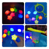 Glow-in-the-dark animal washing water toys showing various brightly colored, glowing plastic animals in blue water.