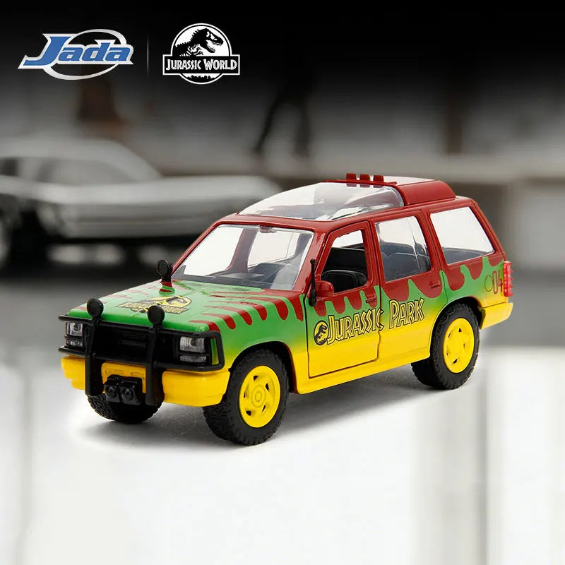 A diecast collectible model of a red and green 1993 Ford Explorer tour vehicle from Jurassic Park.