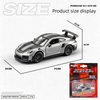 A scale model of a Porsche 911 GT2 RS in silver and grey is displayed with various size measurements.
