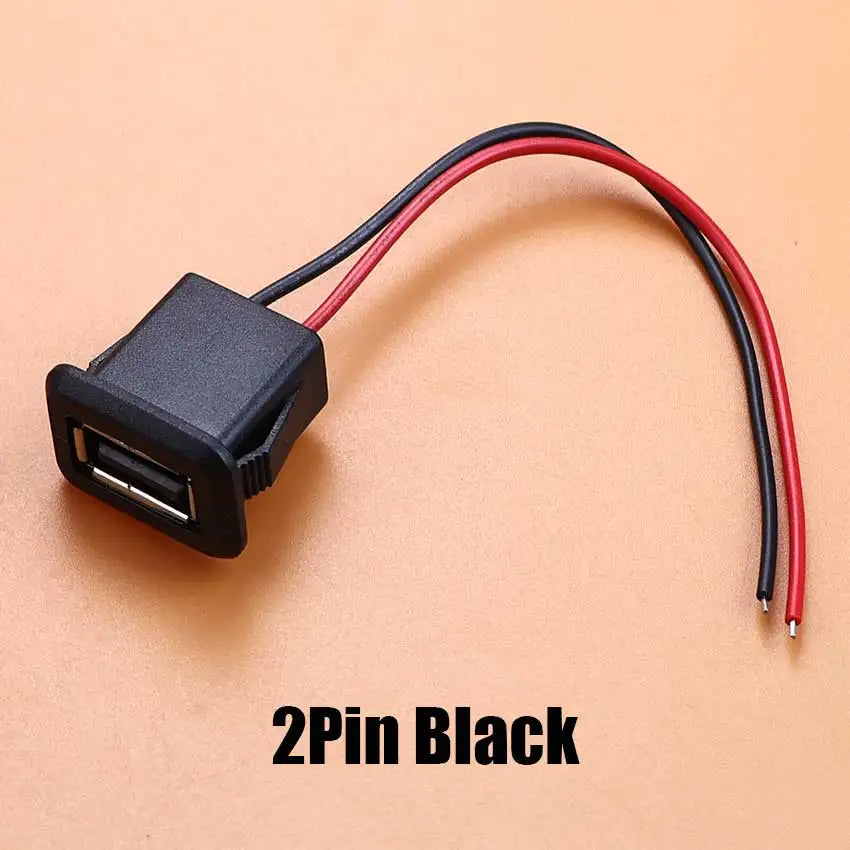 A black 2-pin USB connector with a red and black cable shown against a light background.