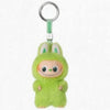 A small, green Labubu plush doll attached to a metal keyring.