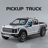 A silver Ford pickup truck model with black accents and blue interior, shown in a side profile.