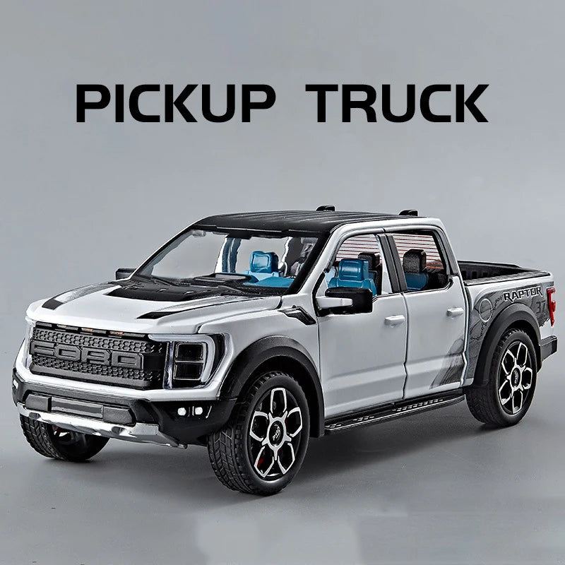 A silver Ford pickup truck model with black accents and blue interior, shown in a side profile.