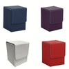 Three deck boxes in navy blue, purple, and red leather for trading cards