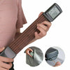 A hand holds a pocket guitar chord trainer with a rotatable LCD display and a separate tuning tool.
