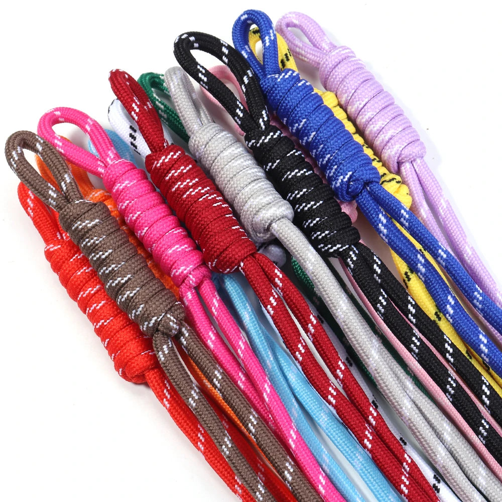 A collection of colorful braided lanyards in various shades including red, pink, blue, and yellow.