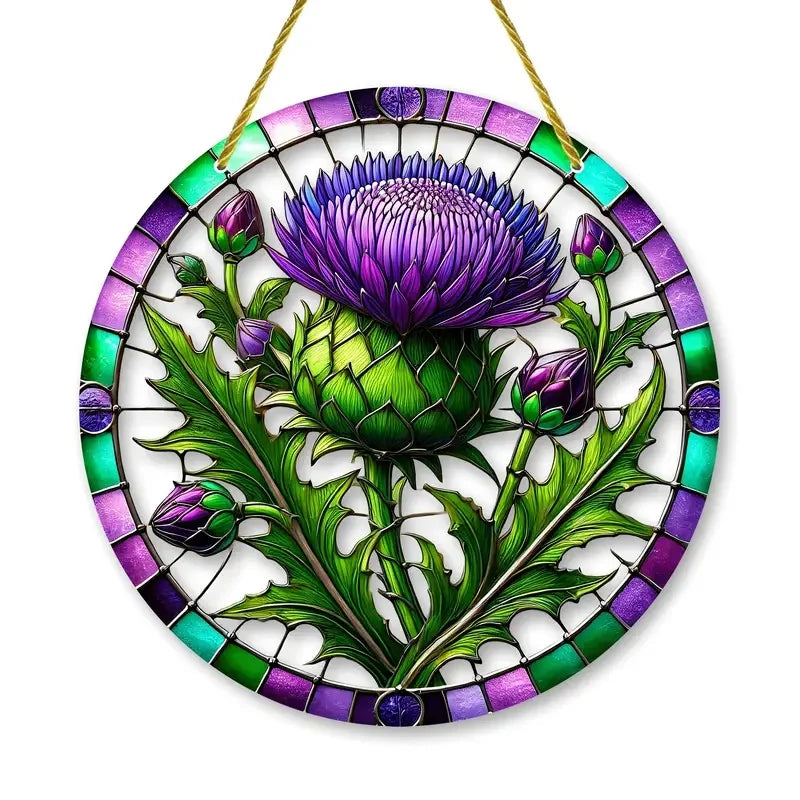 Round acrylic window hanging featuring a purple thistle flower design with green leaves and purple accents.