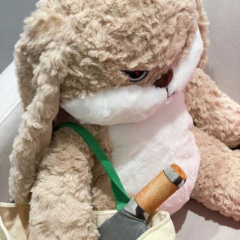 A light brown fluffy rabbit plush doll with white accents is shown in a close-up view.