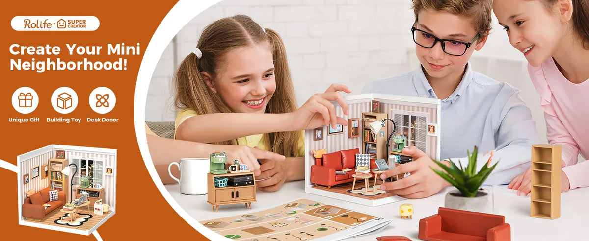 Two children are assembling a DIY miniature house kit for a neighborhood project.