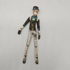 A poseable plush doll figure dressed in a military-style uniform with a helmet and mask.
