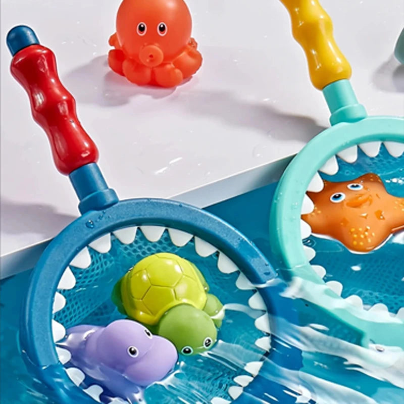 A blue water squirting toy featuring a fishing net and a yellow turtle bath toy.