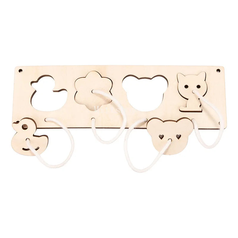 A wooden Montessori busy board featuring various cutout shapes including a castle, bulldozer, and bear faces.