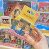 A hand holds a Sylvanian Families Cookie Bear Twins Family Set packaged in its box.