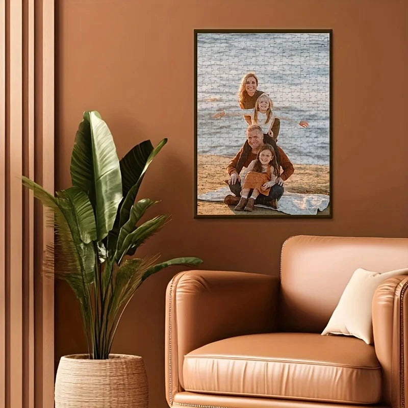 A framed photo jigsaw puzzle featuring a family portrait of three people on a beach.