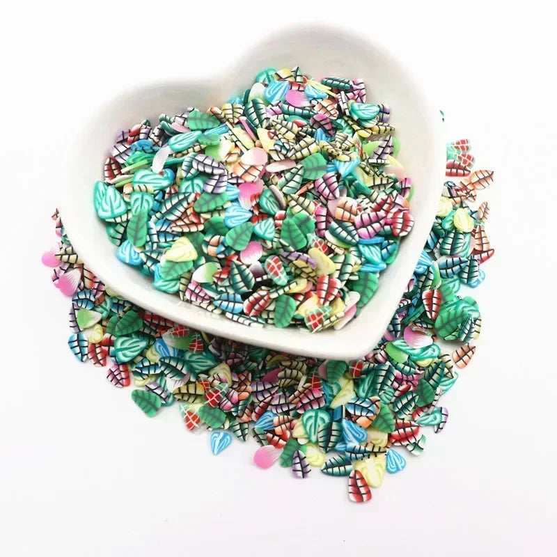 A white bowl filled with colorful polymer clay sprinkles for slime and craft decor