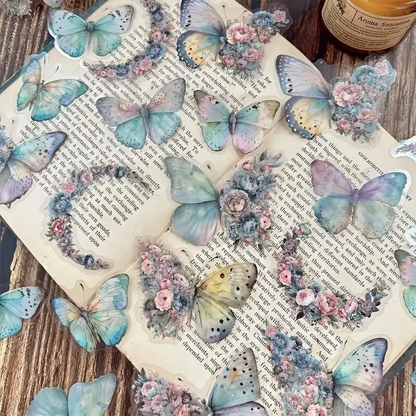 Ein Set dekorativer Aufkleber mit Schmetterlingen und Blumen auf weißem Hintergrund.