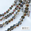 A set of 10mm Austrian crystal beads with AB coating in various shades of brown and purple.