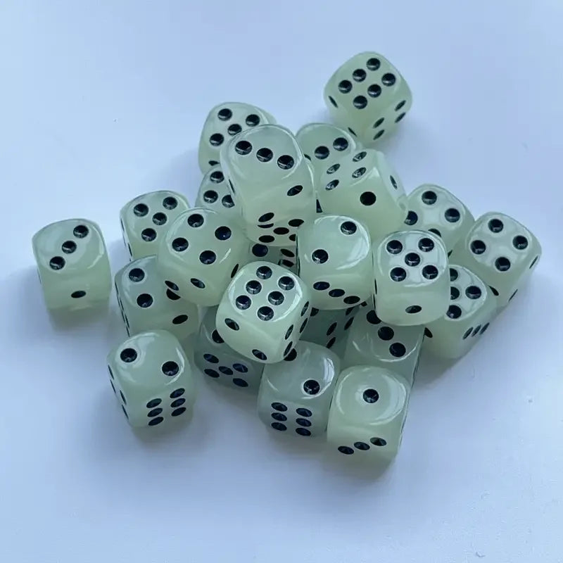 A pile of ten glow-in-the-dark dice in various shades of pale green and white.