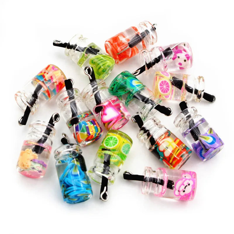 A collection of twenty assorted resin fruit and drink charms in various bright colors and shapes for jewelry making