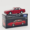 A red Tomica Honda Prelude die-cast model car displayed in its packaging box.