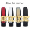 Four versions of a SLADE resin alto saxophone reed in red, white, gold, and black shown for demo use.
