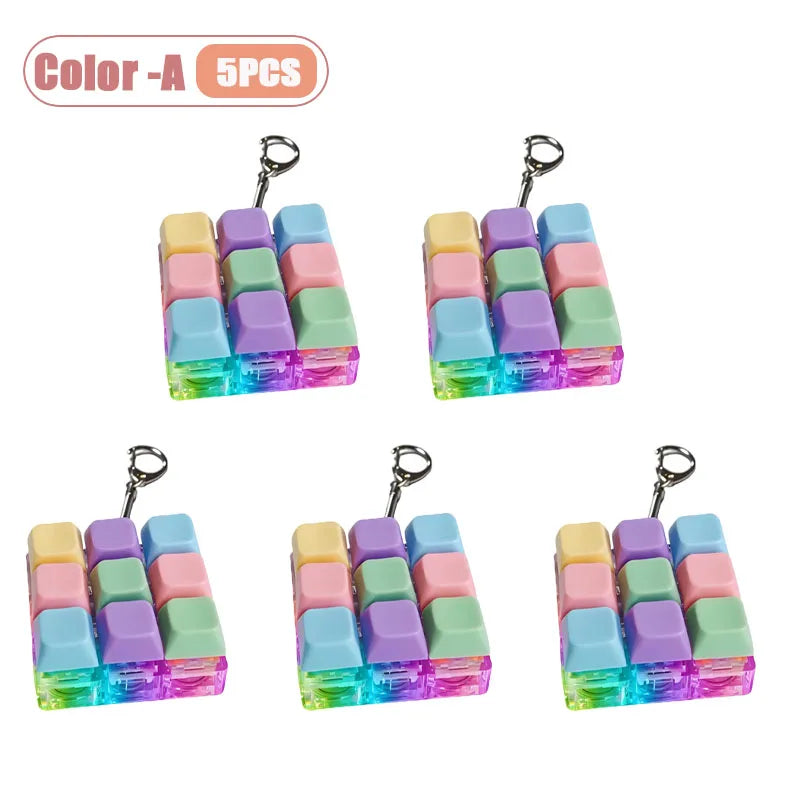 Five colorful LED keyboard keycap fidget lockets with metal clasps for stress relief