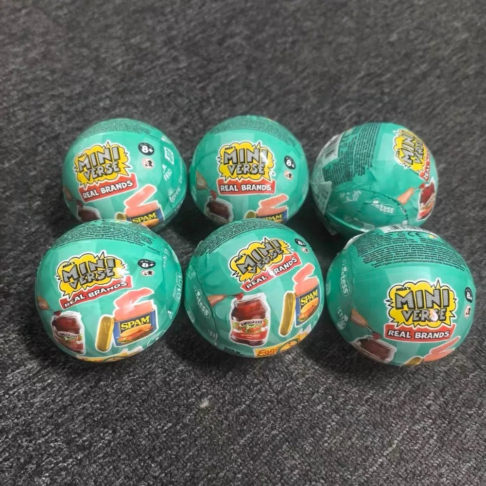 Five green Mini Verse vending machine toys with snack dispensers and surprise balls arranged on a dark gray surface.