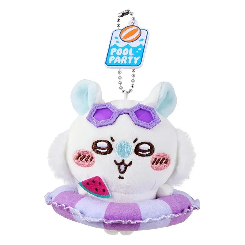 A white plush keychain charm of a cat wearing purple sunglasses and sitting on a purple swimming ring with a pool party tag.