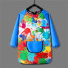 A colorful kids waterproof long-sleeve art smock and dining bib with paint splatters
