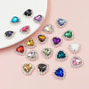A collection of heart-shaped flatback sew-on rhinestones in various colors and clear settings.