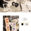 A collection of various scrapbook stickers and paper elements for DIY crafts laid out on a white surface.