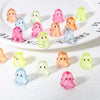 A collection of colorful acrylic ghost beads in various shades are displayed on a white plate.