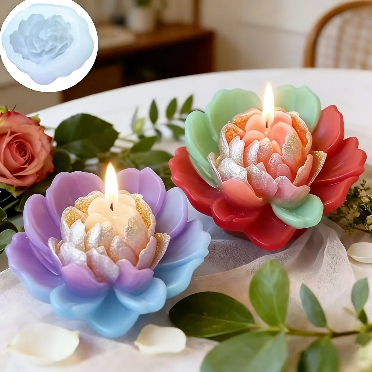 Pink and purple silicone flower molds with lit candles arranged on a white cloth.