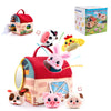 A set of soft plush farm animals including a mini barn toy and various animal figures.