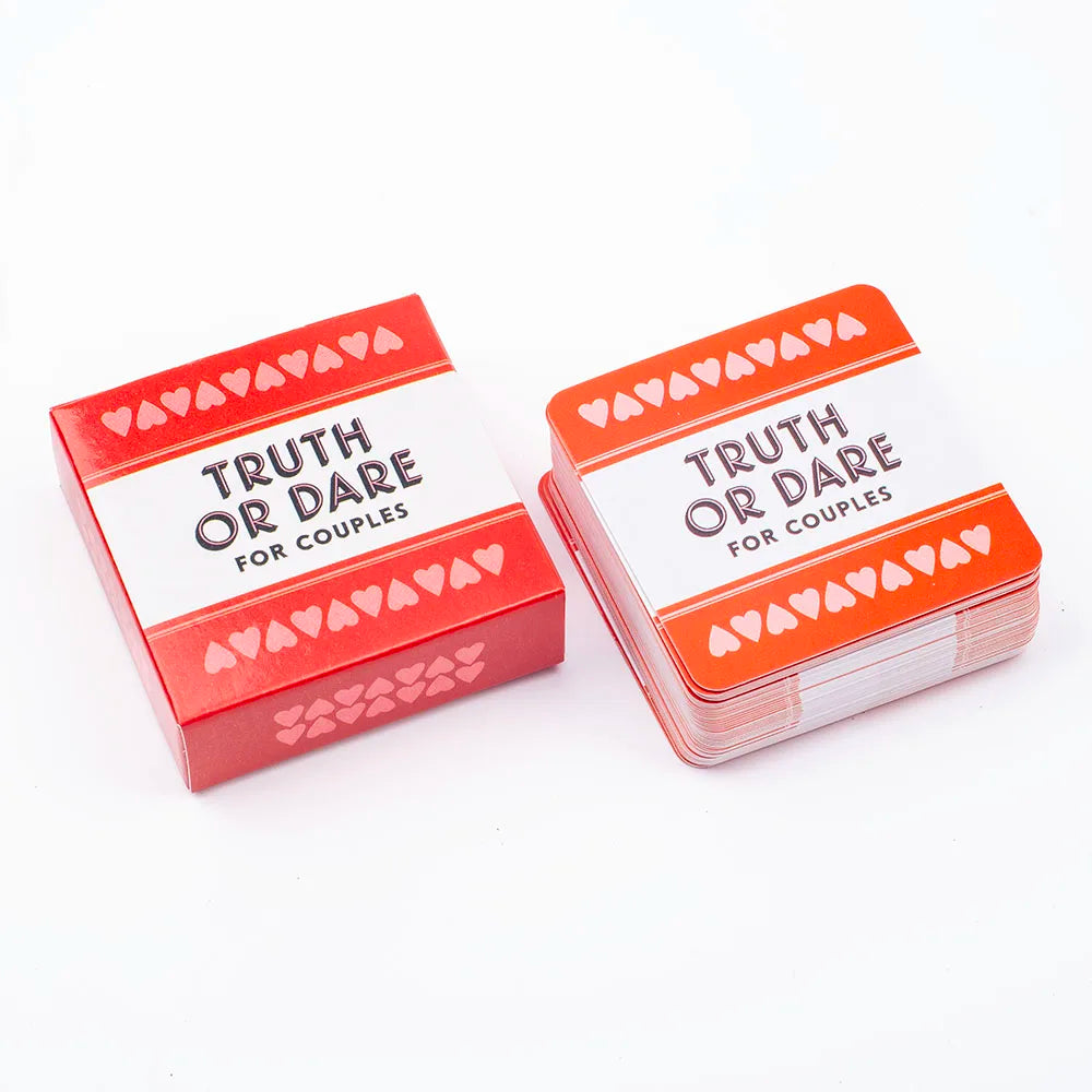 A box of Truth or Dare cards for couples featuring red and orange packaging with heart patterns.