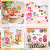 A collection of colorful glitter flower round stickers for crafts, gift wrapping, and party favors displayed on pink and whit