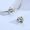 Sterling silver charm bead pendant featuring a car, key, and other elements on a chain.