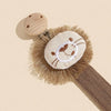 A beige elephant pacifier holder featuring a felt elephant head and a wooden clip on a brown strap.