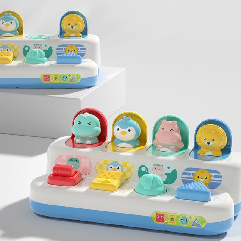 A white and blue peekaboo pop-up animal toy featuring various colorful animals like a lion, bear, and bird for cause and effe
