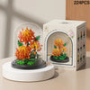 A box of 224 pieces of DIY micro building blocks forming an eternal flower garden inside a clear dome.