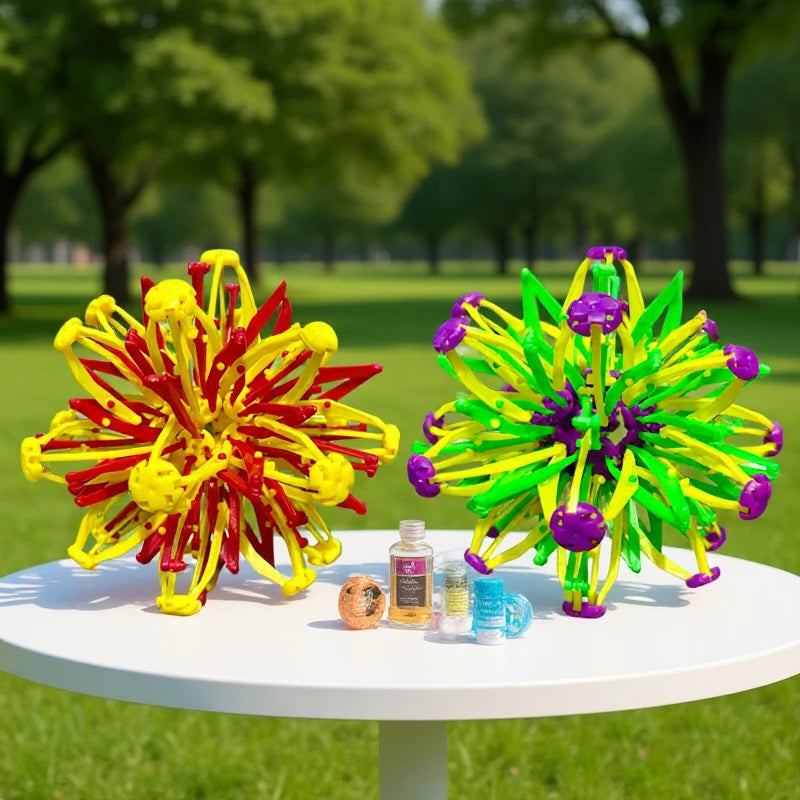 A vibrant, expandable magic ball toy featuring bright yellow and green balls with purple accents, displayed on a white table.