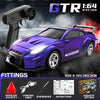 A purple GTR 1:64 racing car model is shown with a remote control gun and various fittings.
