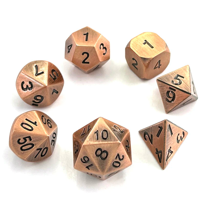 A set of ten premium metal polyhedral dice with a multicolor gold finish arranged on a white surface.